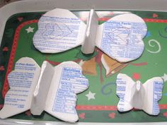 four pieces of ice cream sitting on top of a green tray covered in white paper