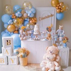 a baby shower with teddy bears and balloons