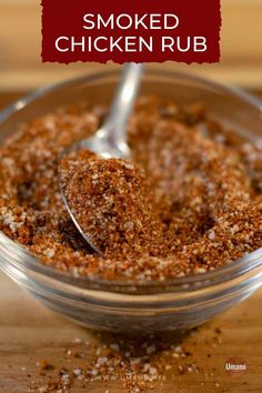 a small bowl filled with spices on top of a wooden table