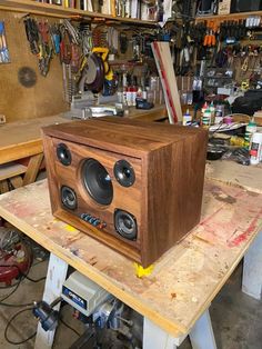 a wooden speaker sitting on top of a table