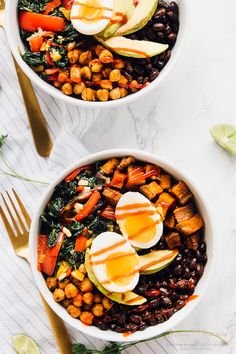 two bowls filled with beans, avocado, and boiled eggs on top of each other