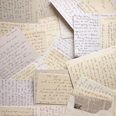 many pieces of paper with writing on them