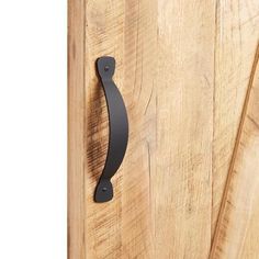 a wooden door with a metal handle on it