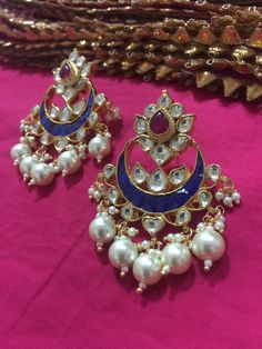 *It's Handmade Indian Ethnic Kundan Chandbali Designer Fashion Earrings with Pink and Blue Combination. *It's Multi Color Kundan Stones Settings and 22k gold Plating as shown in picture. *It is Real Kundan Design with Antique Touch and 2 inch long with hangings of pearls. *Our all jewelry is made from semiprecious stones and beads. *WARRANTY: ITS GENUINE HANDMADE JEWELRY AND WE ARE GIVING LONG LIFE WARRANTY FOR OUR ALL ITEMS. All of our Kundan Jewelry is 100% handmade with ancient Kundan stone s Blue Fusion Earrings With Latkans, Blue Jhumkas With Latkans Drop Earrings, Blue Jhumkas Drop Earrings For Festive Occasions, Blue Festive Jhumkas Drop Earrings, Bohemian Blue Danglers For Wedding, Blue Bohemian Danglers For Wedding, Blue Tilla Jhumkas For Gift, Blue Jhumkas With Latkans For Celebration, Blue Latkans Jhumkas For Celebration