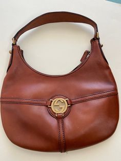 This beautiful Gucci Bag has a very good condition. It has some small signs on it, you can see on last photo, but still it is beautiful. Serial Number is   114869 213048 Condition is 9/ 10 Dimention:On photo About us This piece has been specifically selected by us, for you. We choose vintage and antique items which we think are beautiful, elegant and classic. We sell vintage items and we try to describe them accurately but i am not an expert. Please keep in mind that items are used and can show Vintage Hermes Crossbody Bag, Vintage Gucci Aesthetic, Vintage Leather Bag, Pretty Bags, Vintage Bags, Antique Items, Gucci Bag, Vintage Gucci, Brown Leather