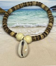 This OOAK cowrie shell 🐚 stretch bracelet is made with a gorgeous cowrie shell focal and beautiful, natural wooden beads. It’s such a gorgeous unisex bracelet that can be worn year round. Perfect for the summer🌊🐚☀️. ***7 inches in length on 100% polyester stretch cord, not wire. Cowrie Shell Bracelet, Cowrie Shell Jewelry, Beach Bracelet, Beach Bracelets, Shell Bracelet, Mothers Necklace, Unisex Bracelets, Cowrie Shell