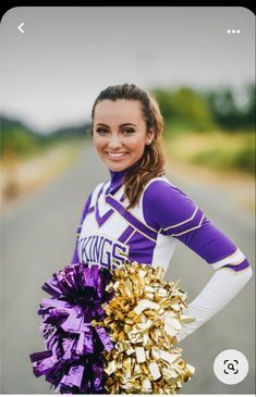 a girl in purple and gold cheerleader outfit