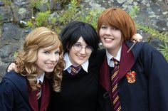 three young women in harry potter costumes posing for a photo with their arms around each other