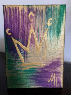 a painted canvas with a crown on it