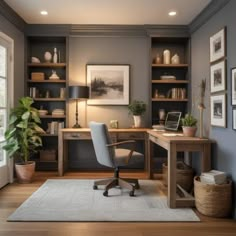 a home office with gray walls and wooden floors