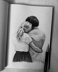 a pencil drawing of two people hugging each other in front of a book with a pen next to it