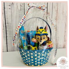 a basket filled with toys on top of a table