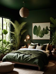 a bedroom with green walls and lots of plants in the window sill, along with a large bed