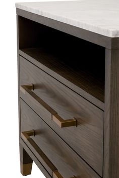 a close up of a wooden dresser with drawers on it's sides and marble top