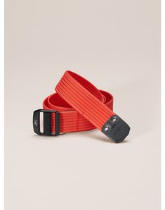 an orange belt with a black buckle on it