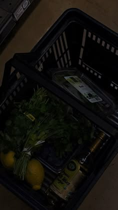 an open grocery basket filled with vegetables and drinks