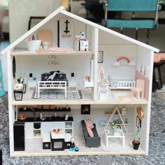 a doll house with furniture and accessories in it