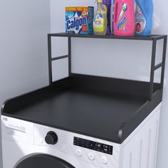 a washer and dryer in a room with shelves on the wall above it