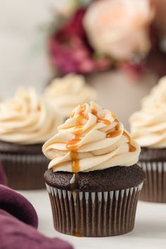 cupcakes with frosting and caramel drizzle on top