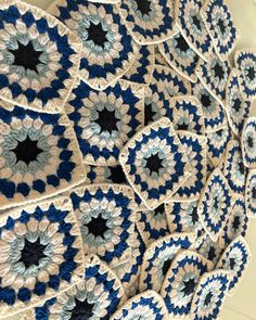 blue and white crocheted doily hanging from the ceiling