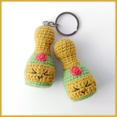 two crocheted keychains that have been made to look like cartoon characters