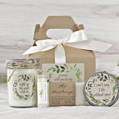 a gift box with candles, soap and other items