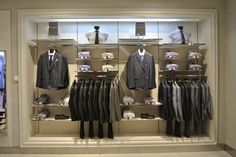 a man's suit and tie display in a store