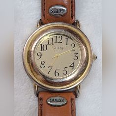 Vintage 90s Guess Women's Gold Tone Watch On Tan Leather Band.  This watch is used and has scratches and wear present.  Heavy wear present to band. 90s Women, Guess Vintage, Cool Jewelry, Women Wrist Watch, Wrist Watches, Leather Band, Tan Leather, Womens Watches, Vintage 90s