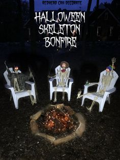 halloween skeleton skeletons sitting around a fire pit in the middle of a yard at night