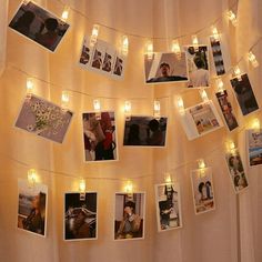 a string of lights with pictures hanging from it's sides and photos on them