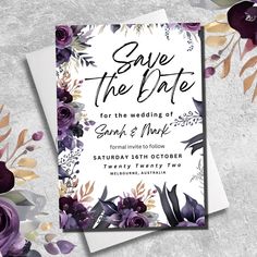 save the date card with purple flowers and greenery