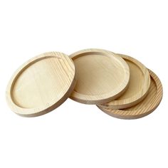 three wooden plates sitting on top of each other