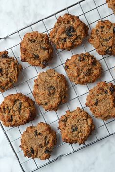 some cookies are cooling on a rack and ready to be eaten by someone in the kitchen