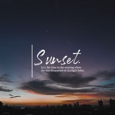 the words sunset are written in white on a dark blue sky with clouds above it