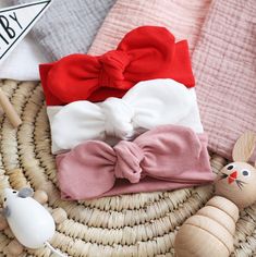 "This set of 3 baby headbands are hand crafted from the highest quality stretch Cotton Jersey fabric. The fabric is wonderfully soft and stretchy perfect for delicate skin and hair. Featuring a tie centre design, you can easily un tie and adjust to suit your baby's style.  The colours you will receive in this set are: Red, Cream & Rose The sizes available are: 0-3m 13\" 3-6m 14\" 6-9m 15\" 9-12m 16\" 1-2y 17\" 2+y 18\" Your order will arrive on a display card carefully wrapped in tissue paper, perfect to be sent directly as a gift.  Milk Teeth Clothing is a British based children's clothing company specialising in comfortable and stylish clothing for ages 0-6 years. All items are lovingly handcrafted by a mum of one.  For special offers and updates: @milkteethclothing" Knotted Baby Headband, Toddler Headband, Newborn Hats, Rose Headband, Stylish Headbands, Baby Head Wrap, Baby Bow Headband, Toddler Headbands