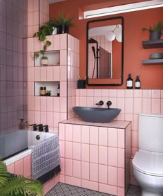 a bathroom with pink tiles and black accents