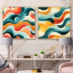 two paintings on the wall in a living room