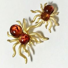 Vintage Gold Honey Amber Spider Tie Lapel Pin & Brooch Mom & Baby Spider Set Great for your insect collection. Also great for Halloween and fall festivities. Simulated Amber Stones All Pins are unique just like real amber and will be chosen at random from the collection. If you have a preference in a lighter or darker hue, please let me know when you purchase and we will do our best to find you what you like if available. Yellow gold plated matte finish. Gold tone metal alloy base. Vintage old store stock. Made in USA in Rhode Island. New condition, never worn. Spider Brooch, Halloween Plates, Spider Jewelry, Insect Collection, Fall Festivities, Insect Jewelry, Amber Stone, Themed Jewelry, Wine Charms