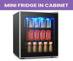 mini fridge in cabinet with six soft drinks