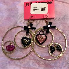 Betsey Johnson Dangle Earrings Fuschia Lips W Ab Stone, Black Bows W Ab Crystals, Pink Crystal Heart, Black Heart W Gold Bow In 2 Dangle Circles. “Matching Necklace In Another Listing!” Pretty And So Feminine Betsey! Size: 2” Wide X 2.75” Long $50 Retail New On Betsey Card W Betsey And Bloomingdale's Labels Nwt From Bloomingdale's Heart Shaped Bow Jewelry For Party, Heart Shaped Party Jewelry With Bow, Elegant Bow Heart Earrings For Party, Pink Heart-shaped Jewelry With Bow, Heart-shaped Bow Earrings For Party, Party Heart Earrings With Bow, Heart Shaped Bow Earrings For Party, Pink Bow Jewelry For Valentine's Day Party, Valentine's Day Pink Bow Jewelry For Party