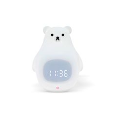 an alarm clock with a white bear face on it