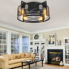 a living room filled with furniture and a fire place in front of a fireplace surrounded by bookshelves