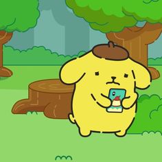 a yellow dog holding a cell phone in its mouth while standing next to a tree