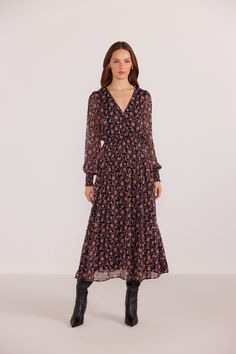 Get ready to turn heads in our Regal Ditsy Floral Midi Dress! This charming dress features a stunning floral print, long sleeves, and a v-neckline. The elastic cinched waist not only adds a touch of flair, but also provides a flattering fit. Perfect for a day out or a special occasion! Faux wrap bodice with snap closure Elastic waistband Semi-sheer long sleeves with elastic cuff Fully lined 100% Polyester Lining: 100% Viscose Hand wash cold Model is wearing a size Small Cream Midi Dress, Ivory Dresses, Paisley Dress, Mink Pink, Brown Dress, Ditsy Floral, Floral Midi Dress, Lovely Things, Cinched Waist