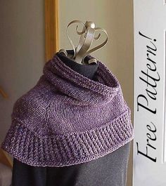 a purple knitted hat with scissors sticking out of it