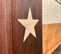 a wooden box with a star on it