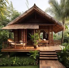 a small wooden house in the middle of some trees and grass with steps leading up to it