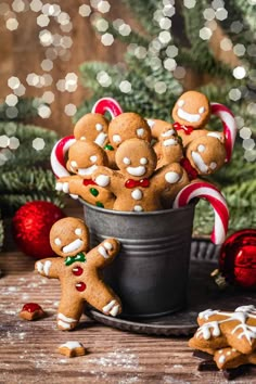 gingerbread cookies in a bucket with candy canes