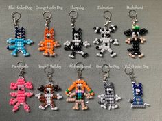 a bunch of different types of beaded keychains on a gray surface with words written below them