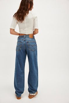 *The* perfect retro-inspired jeans from Levi's. **Fit:** Mid-rise, straight-leg silhouette with slouchy fit **Features:** Zip fly and button closure, five-pocket design, rigid denim fabrication **Why We | Levi's Baggy Dad Jeans at Free People in Medium Wash, Size: 26 What To Wear Today, Dad Jeans, She Said, Levis Jeans, Jean Outfits, Retro Inspired, Jeans Shop, Boho Outfits, Straight Leg Jeans